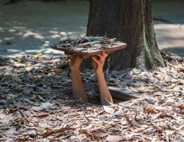 Tourist at the entrance of Cu Chi Tunnels in Ho Chi Minh, Vietnam, closeup